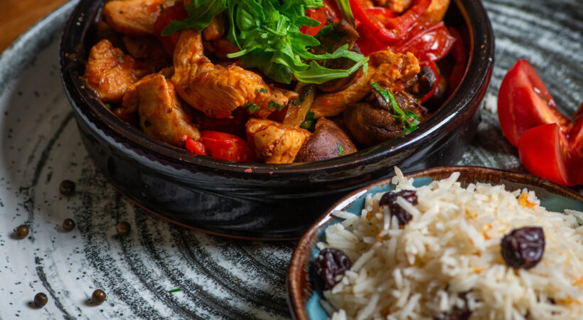 A hot casserole dish served with rice at Mila Loughton